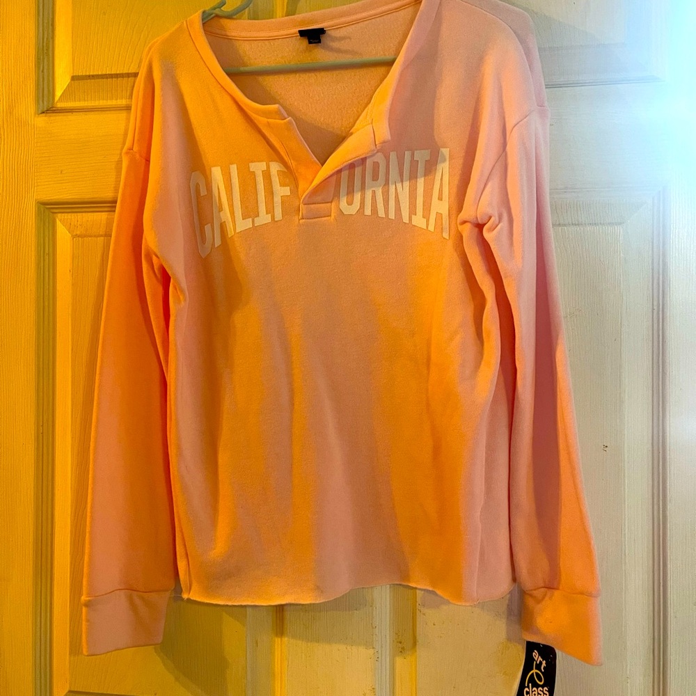 Pink pull over sweater with California written across the front